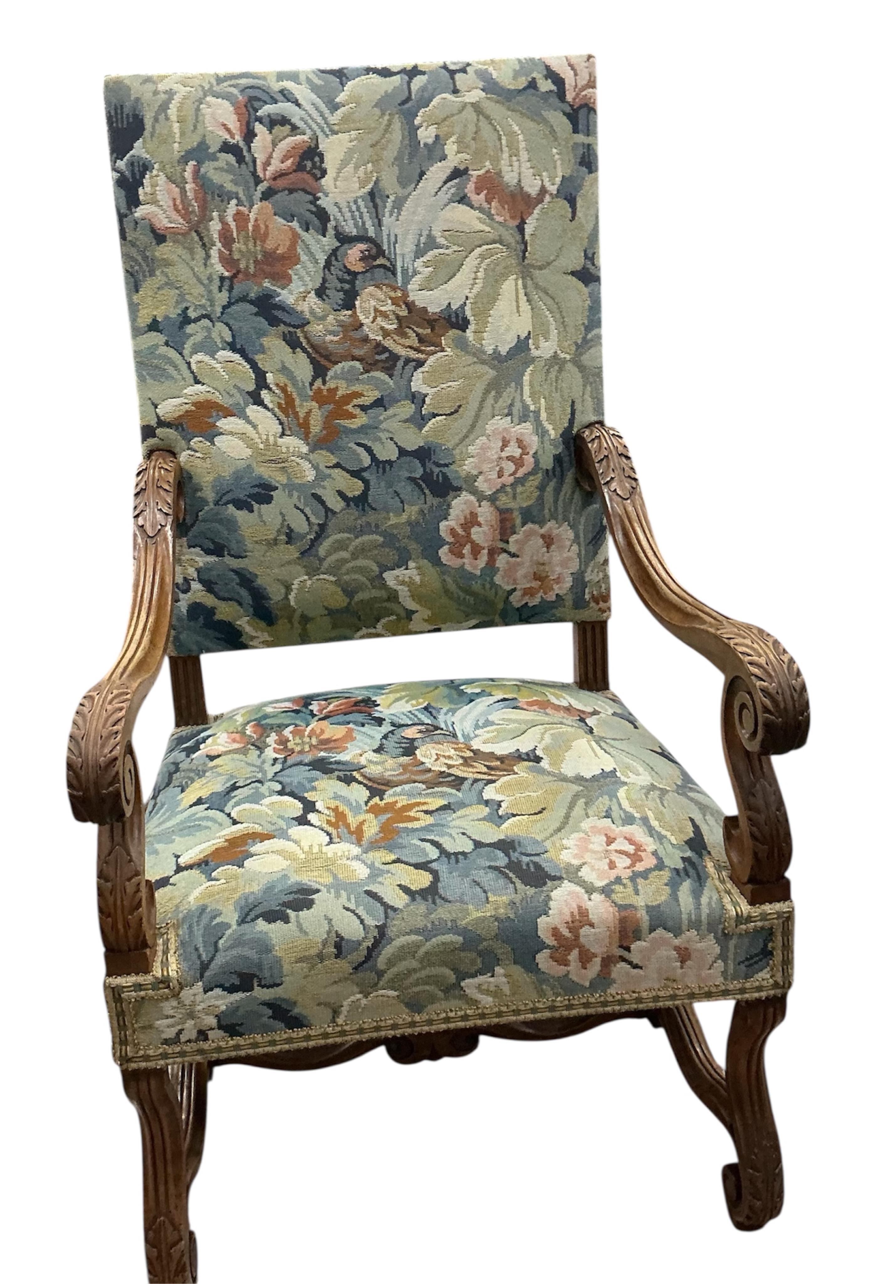 A pair of Louis XIII style walnut armchairs with tapestry upholstery, width 63cm, depth 63cm, height 115cm